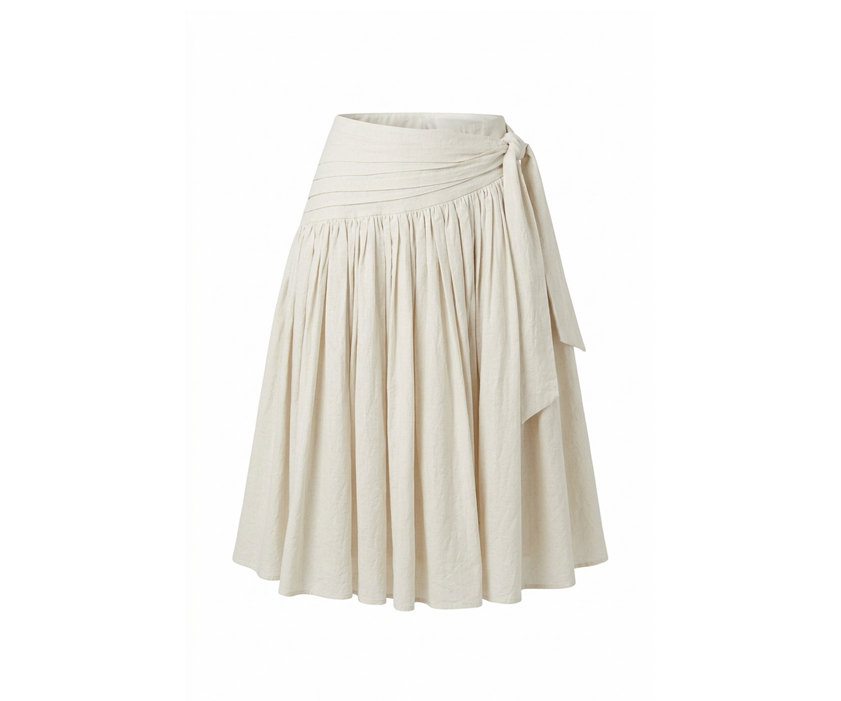 Undra Celeste New York Emma Ruched Waist Full Skirt in Ecru, featuring intricate hand-ruched waistband detailing, an extra-full gathered silhouette, elegant side waist tie, and flowing midi-length skirt. Sophisticated contemporary women's workwear with modern feminine elegance.