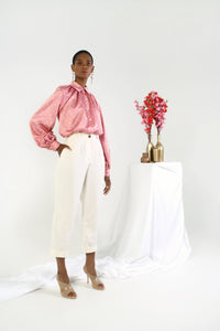 cream cropped paperbag pants on model
