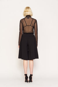 sheer black turtleneck top on model